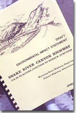 This is a photograph of an Environmental Impact Statement Report done for the proposed Snake River Canyon Highway in Wyoming