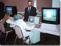 This is a photograph of John Ellsworth conducting a computer visual simulation training seminar for a group of landscape architects.